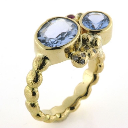 Billede af Ring fattet med 10 syn. stene 14 kt.