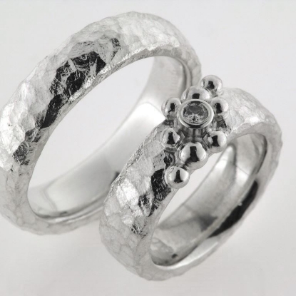 Billede af 1 par vielsesringe, damering fattet med brill. 0,10 w/vs. 925s sølv