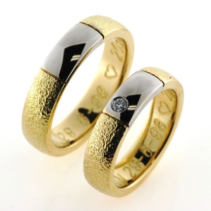 Billede af 1 par vielsesringe med hvidguld, damering fattet med brillant 14 kt.