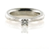 Billede af Ring kraftig rund trekantet skinne, 4 grab chaton, brill. 0,20 w/vs. 14 kt. hvg.